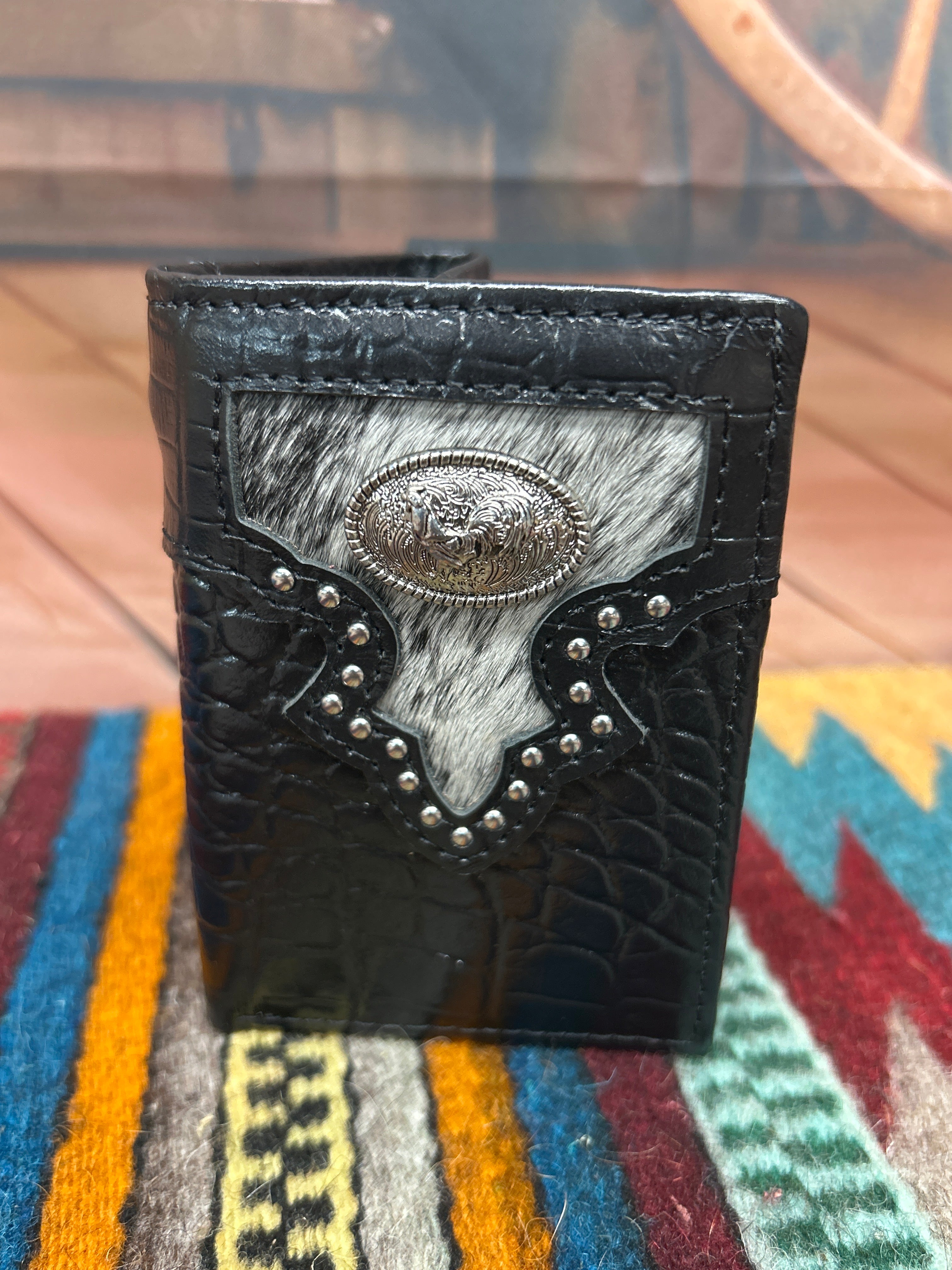 Black alligator print leather trifold wallet with a cowhide inset featuring a Rooster Concho. Front view 