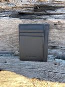 Black leather front pocket wallet with six card slots and a ID window. This wallet has RFID blocking. 
