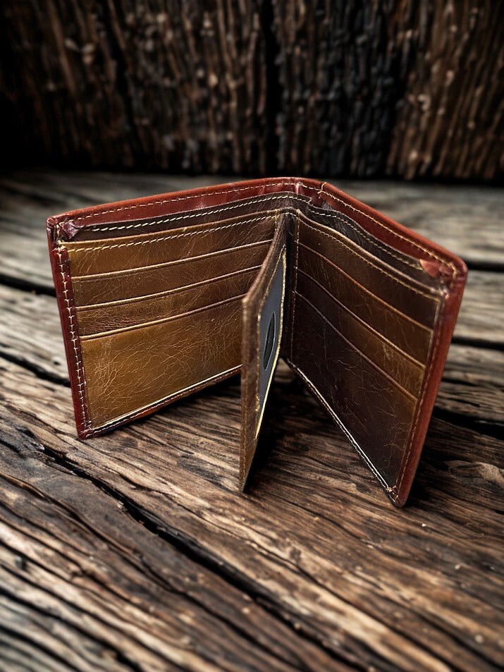 This Brown tooled leather bifold wallet.  Inside view showing multiple card slots and a dual ID window. 