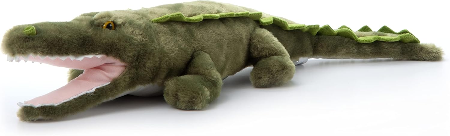 A green plush alligator toy with faux scales down the back, and a pink open mouth with white faux teeth. Angled side view.