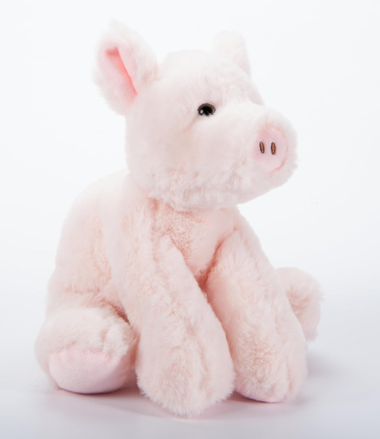 A soft pink plush toy pig with a sitting posture, designed for young children.