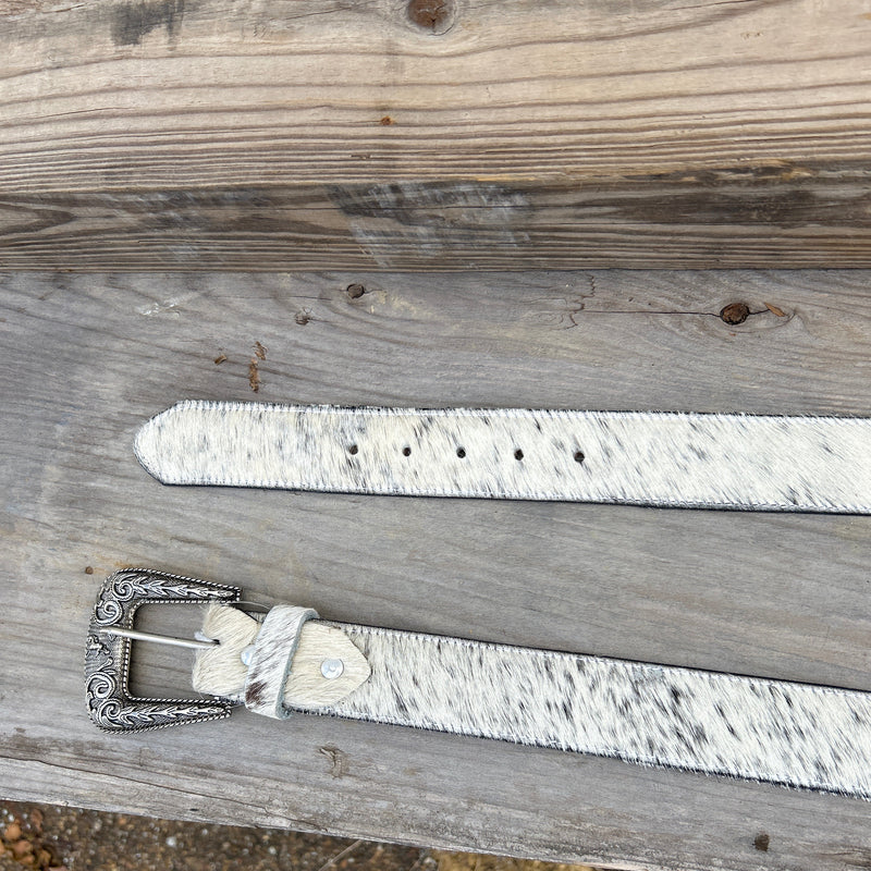 This Cowhide western style belt features a buckle with a intricate design featuring a horse. 44 A