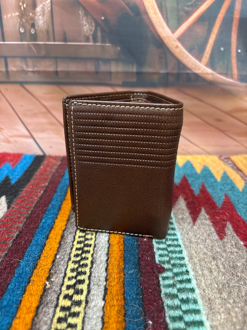 This brown leather trifold wallet has a stitching pattern along the top.  Rear view showing stitching details. 