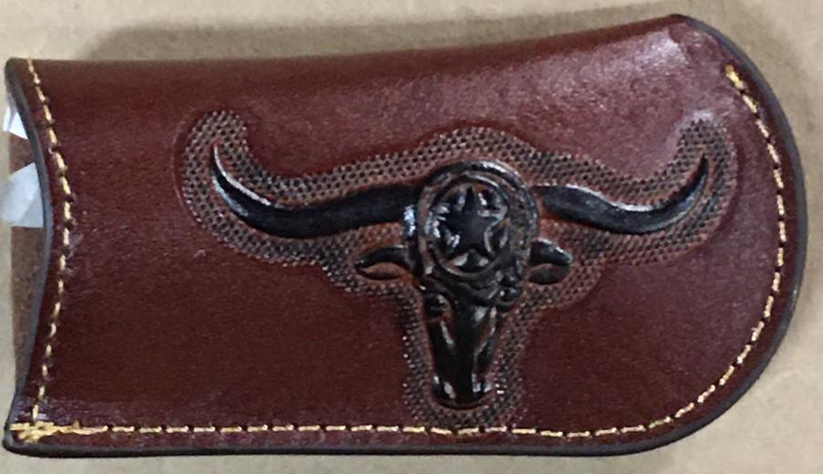 Brown leather cardholder with longhorn bull design on a beige background