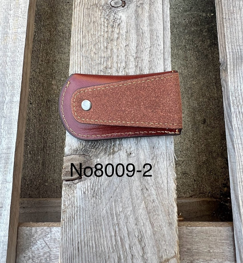 This Coffee Brown knife sheath features a embossed Longhorn design with a Star. Rear view showing leather belt loop. 