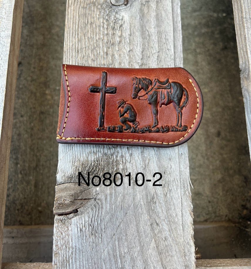 This Brown leather knife sheath from Top Notch Accessories features a embossed Praying Cowboy design. Front View