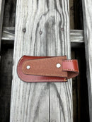 A brown leather knife sheath with a longhorn and star design. Rear view showing leather belt loop.