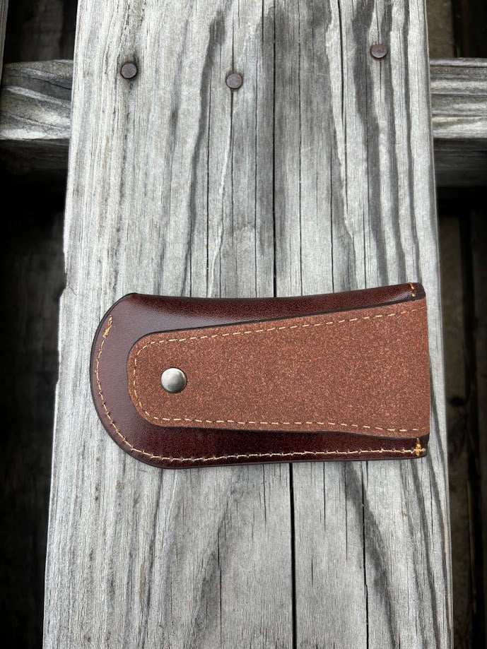 This Coffee Brown leather knife sheath with a Praying Cowboy design on it has a keep closure. Rear view showing leather belt loop attachment. 