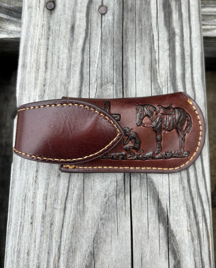 Coffee Brown leather knife sheath with a Praying Cowboy design and a keep. Front View