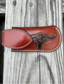 This Brown leather knife sheath from Top Notch Accessories features an embossed Longhorn with Star design, and a keep closure. Front View