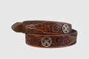 A brown hair-on leather belt with hand tooled designs and two conchos.