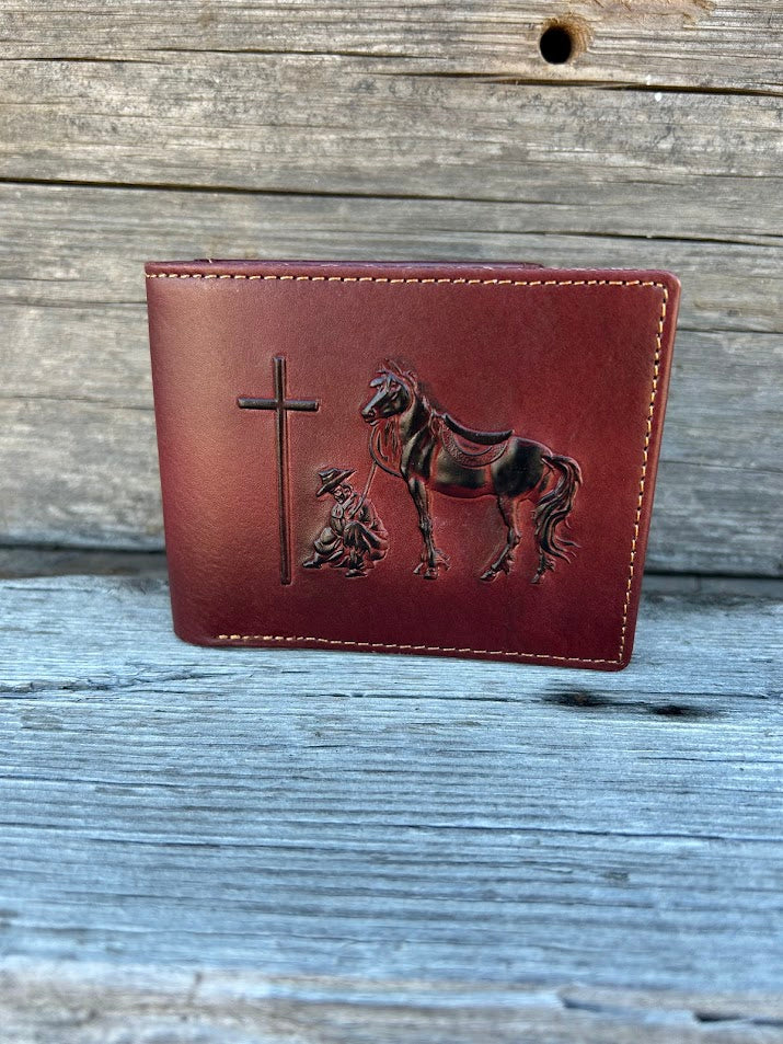 Embossed Praying Cowboy design brown leather bifold wallet. Front View