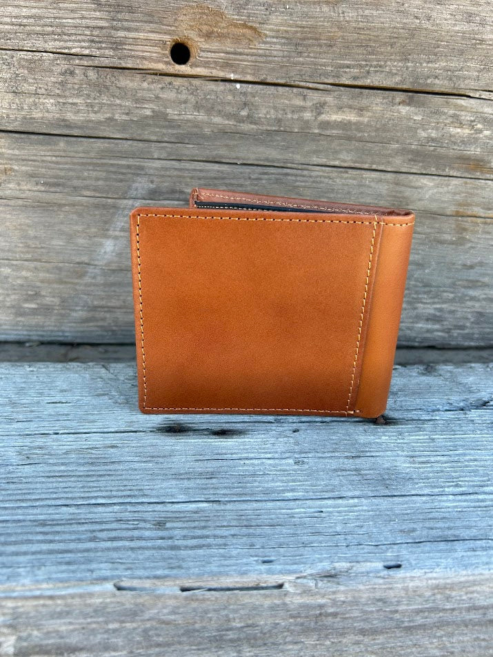 Light brown leather bifold wallet featuring a embossed Praying Cowboy design on the front. Rear view showing extra card slot.