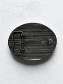 Rear view of Mule belt buckle showing Montana Silversmiths logo.