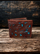 This Brown tooled leather bifold wallet has a Turquoise inlay. Front View