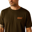 Men's Ariat short sleeve tee in Dark Olive with a armadillo graphic print on back. Front view showing close up of Ariat Boot Company graphic. 