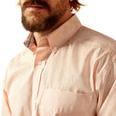 Men's Ariat long sleeve shirt in Pink with a small geometric print. Close up of button down collar and inside contrast pattern band. Also shows Ariat logo on left chest pocket. 