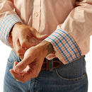 Men's Ariat long sleeve shirt in Pink with a small geometric print. Close up of contrast pattern on cuffs. 