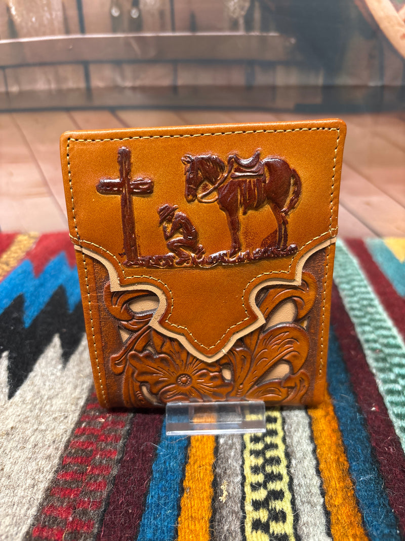 This Brown leather bifold wallet features a embossed Praying Cowboy design and a beige inlay under a tooled pattern.  Front View