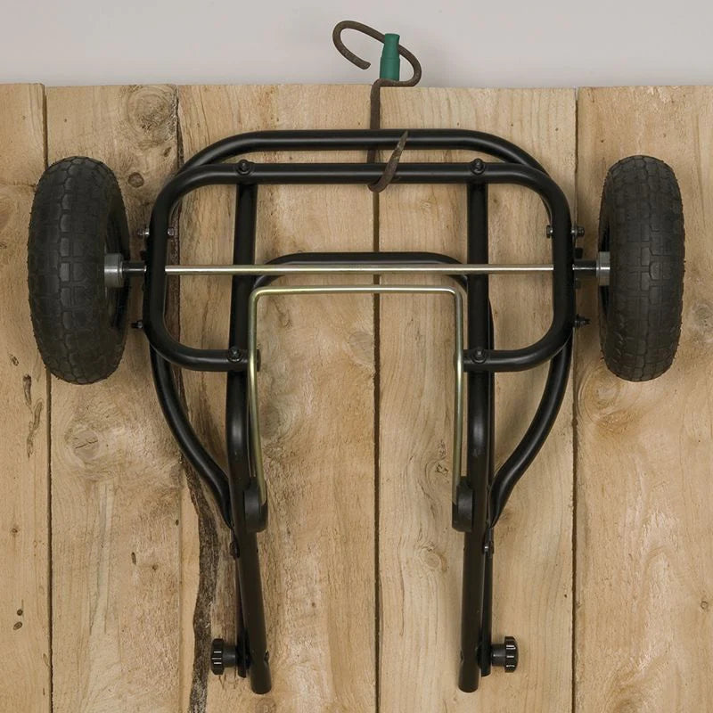 Black Little Giant muck cart assembled. and handle folded so it could be hung on the wall.