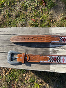 This Red Cross Design embroidered belt has basketweave leather overlay on each end. It has a Silver Western style buckle with a Longhorn design. Close up of both ends showing Basketweave leather details. 