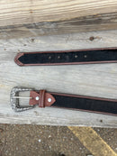 This Cowhide western style belt features a buckle with a intricate design featuring a horse.  34B