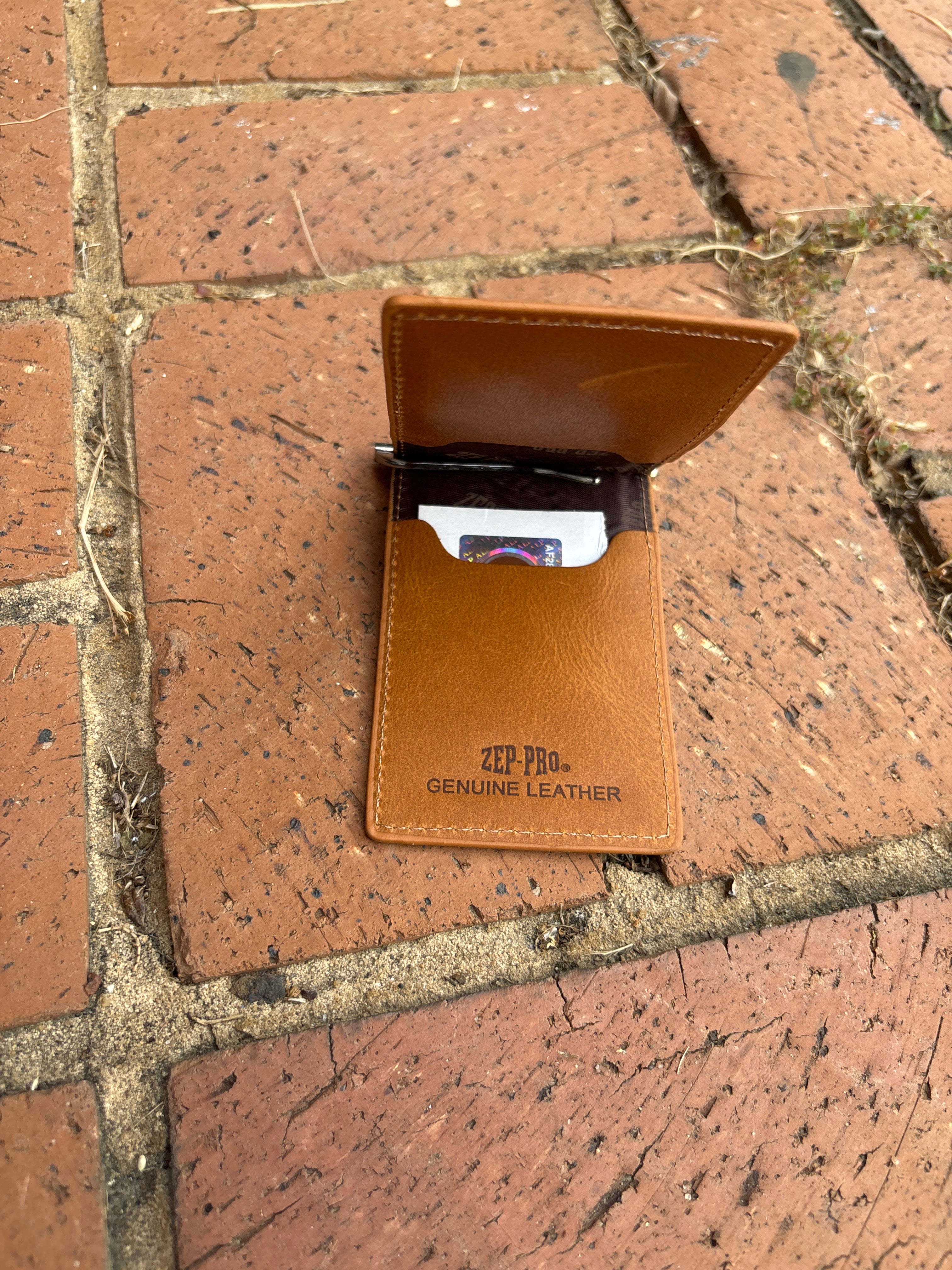Zep Pro Mississippi State University Bulldogs Tan Leather Front Pocket Wallet. Inside view features:
4 interior credit card slots
1 clip bill/cash closure 