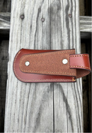 This Brown leather knife sheath from Top Notch Accessories features an embossed Longhorn with Star design, and a keep closure. Rear view showing leather belt loop attachment. 