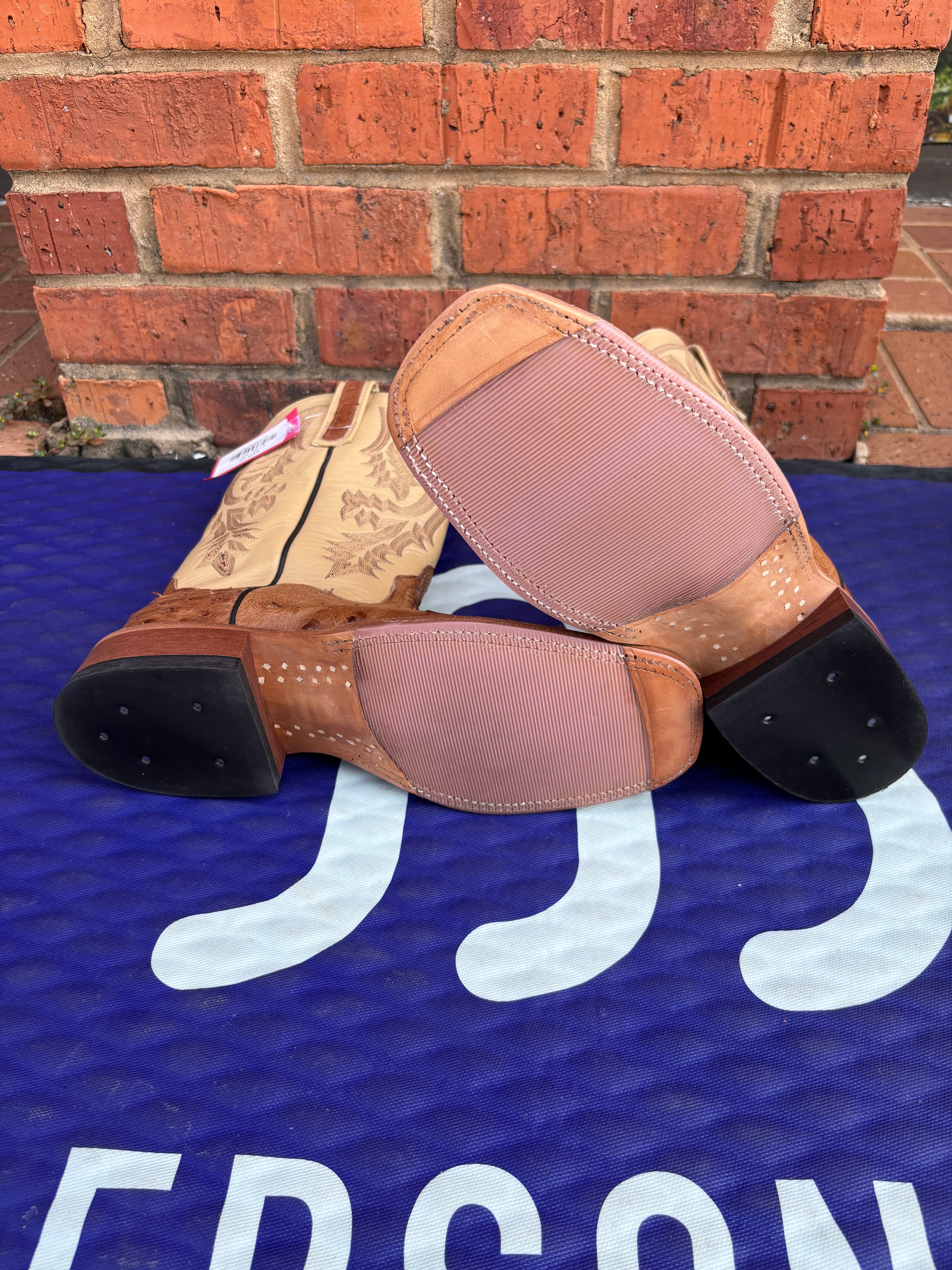 Women's Anderson Bean square toe boots in Tan Full Quill Ostrich with Dromedary Kidskin tops. Bottom view showing the hybrid outsole. 