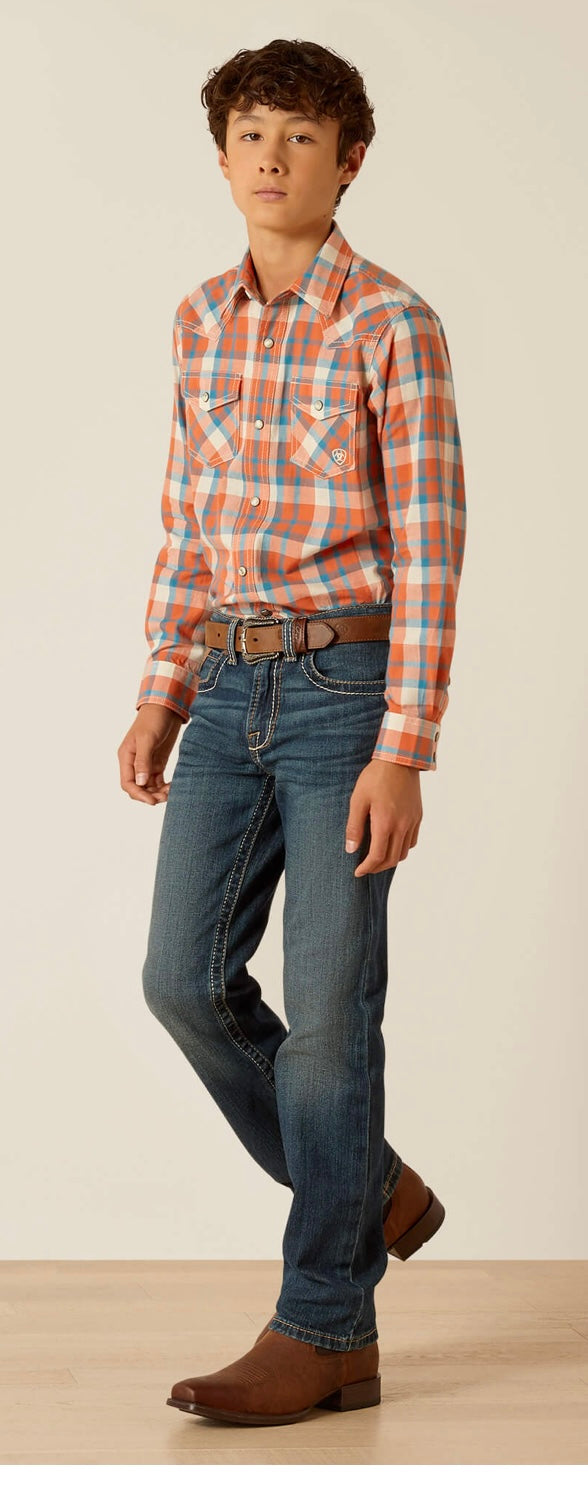 Boy's Ariat long sleeve Retro fit snap shirt in Arabesque, a orange and blue plaid. Full view showing shirt tucked in. 