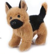 Plush toy German Shepherd dog on a plain background