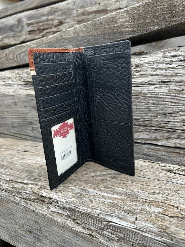 Black leather wallet with a brand label on a wooden surface
