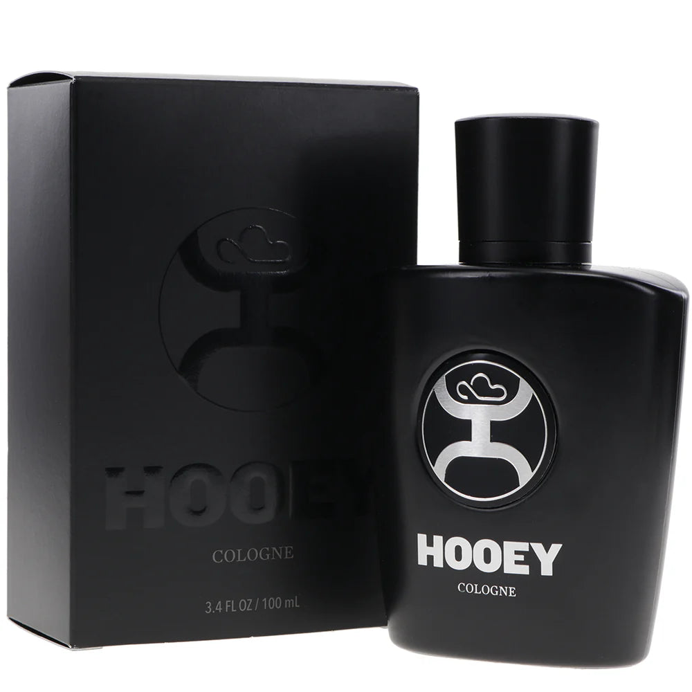 A black bottle of Hooey Men's Black Cologne with a silver logo on the label. Bottle and box view
