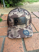 Rectangle leather patch with Oxford, Mississippi Established 1817 on a old school brown camo Richardson 112PFP cap. Cap features a brown mesh back and is adjustable. Front View