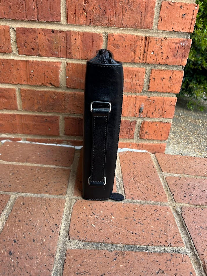 Side view of bible cover showing handle. 
