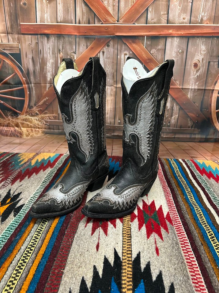 A black leather boot with a silver metallic eagle design on the side and a snip toe. Side View 