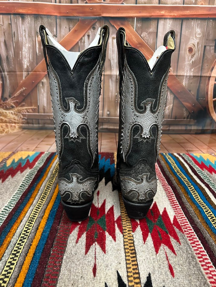 A black leather boot with a silver metallic eagle design on the side and a snip toe. Rear View 