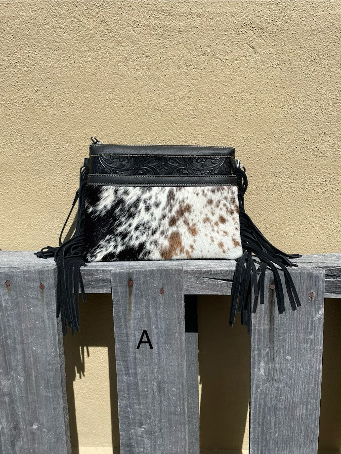 Black leather and crossbody bag with fringe leather sides. Front View A