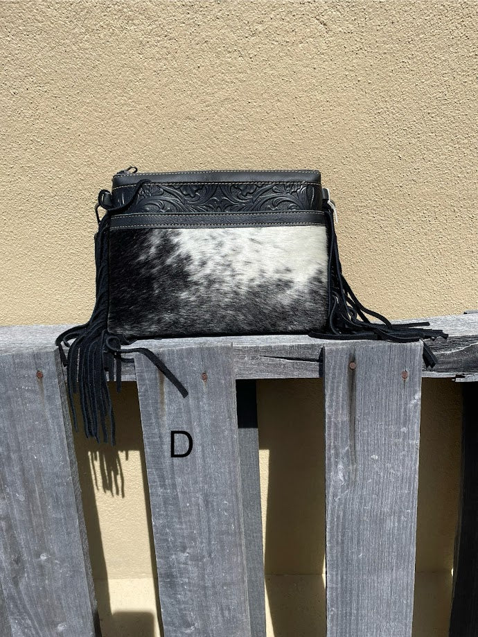 Black leather and crossbody bag with fringe leather sides. Front View D