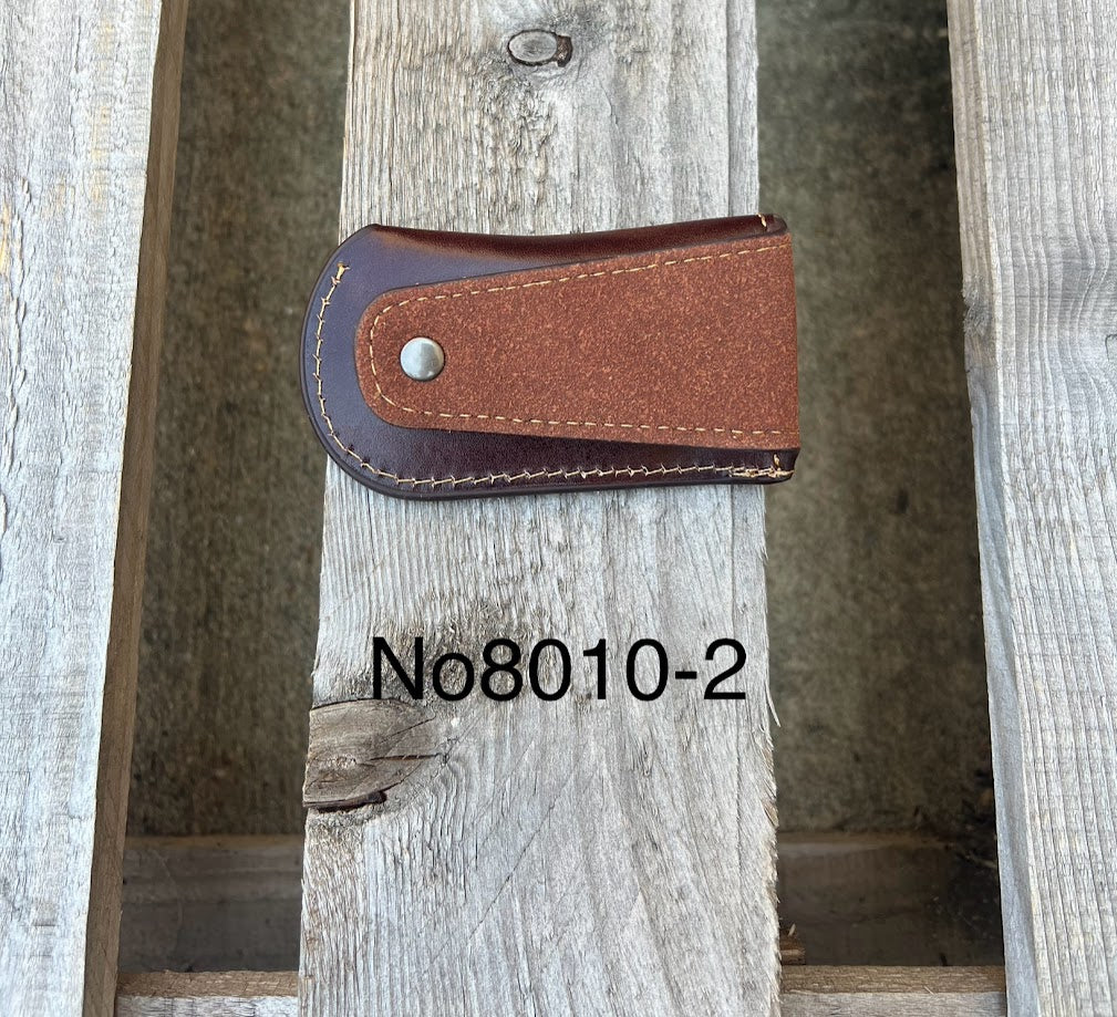 This Coffee Brown leather knife sheath features a embossed Praying Cowboy design. Rear view showing leather belt attachment. 
