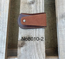 This Coffee Brown leather knife sheath features a embossed Praying Cowboy design. Rear view showing leather belt attachment. 
