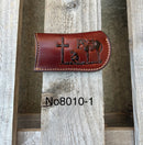 This Brown leather knife sheath from Top Notch Accessories features a embossed Praying Cowboy design and a leather belt attachment. Front View
