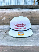 Southern Bred Apparel Co Starkville, MS white cap with black rope. 
Front View