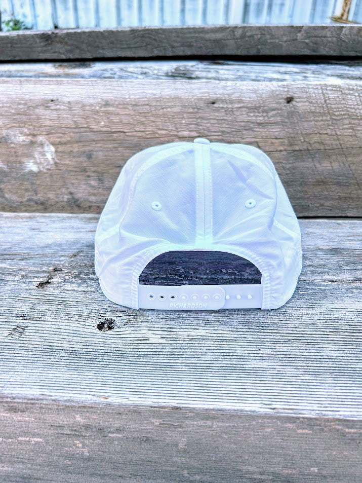 Southern Bred Apparel Co Starkville, MS white cap with black rope. 
Rear View