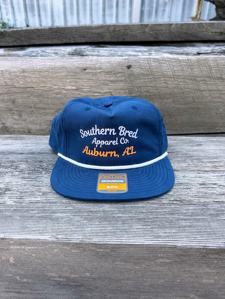 Southern Bred Apparel Co Auburn, AL navy cap with white rope. 
Front  View