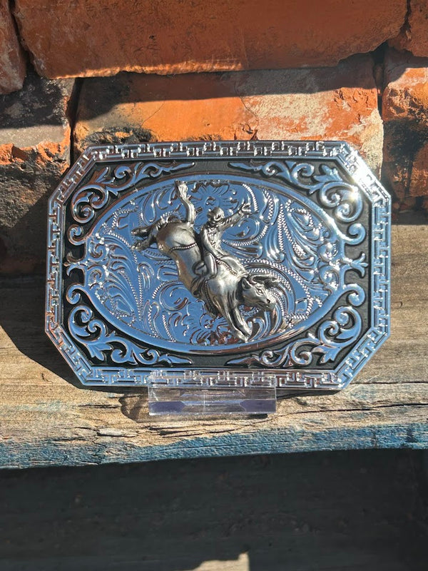 Silver and Black western style belt buckle featuring a Bull Rider. 