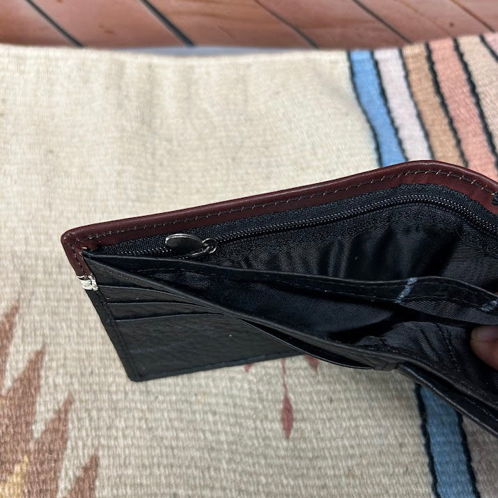 Black leather bifold wallet with Brown overlay and a Longhorn Concho. Dual cash slot views showing zippered pocket. 