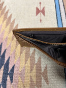 This genuine leather bifold wallet in Brown from Top Notch Accessories features 9 card slots and a ID window. Top view showing dual cash slots and zippered pocket. 