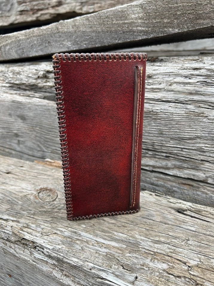 Brown leather checkbook wallet with a embossed rooster design and a whip stitched border. Rear view showing a additional bill slot. 