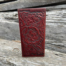 This Brown embossed leather checkbook wallet features multiple card and cash slots for optimal organization. Front View